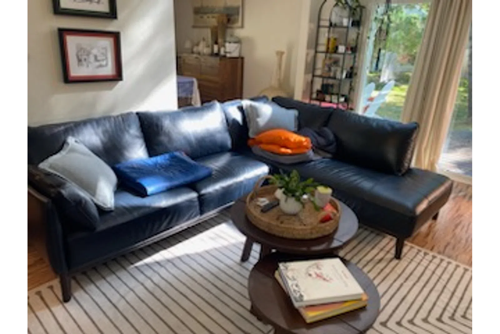 a living room with a black couch