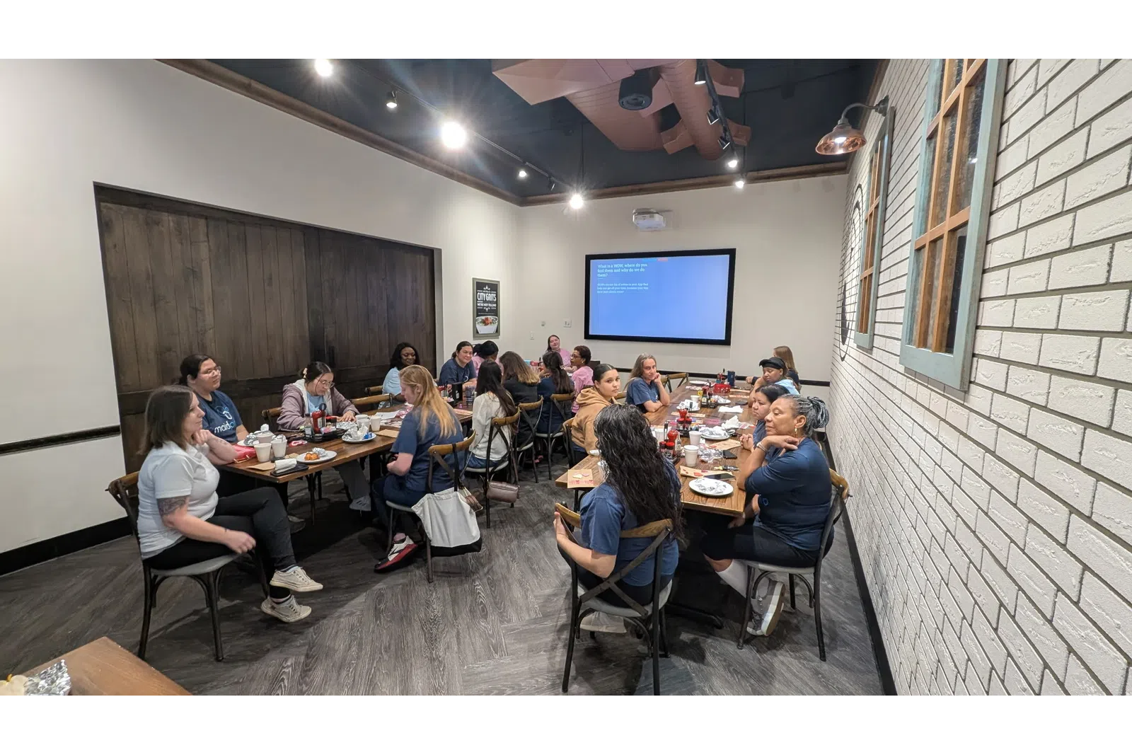 a group of people sitting around a table