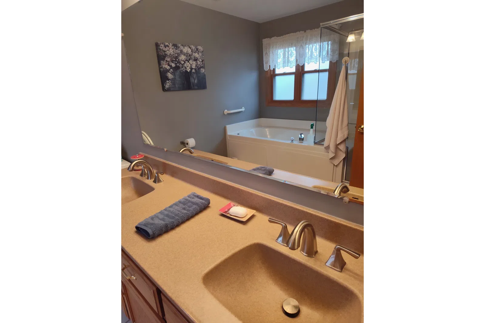 a bathroom with a tub and sink