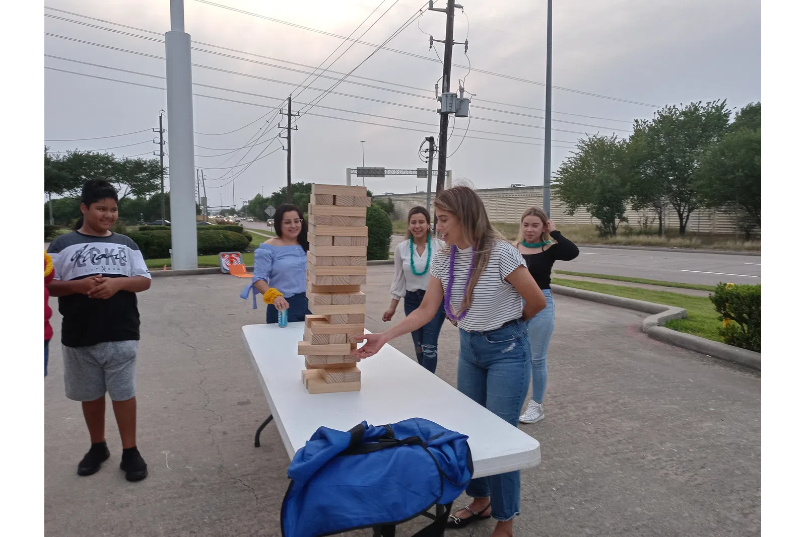 table with giant Jenga at a local event for MaidPro Houston Central