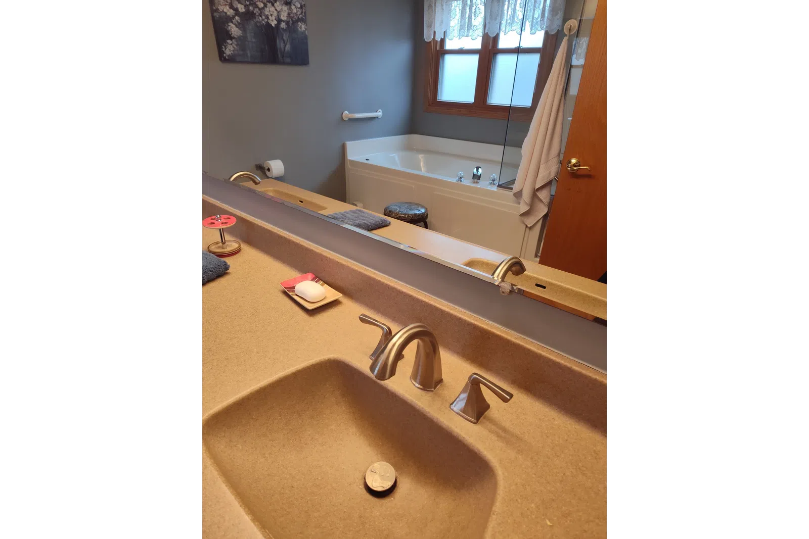 a bathroom with a tub and sink