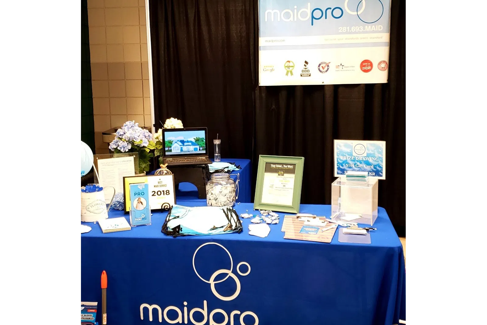 table at a local event for house cleaning pros MaidPro Houston Central