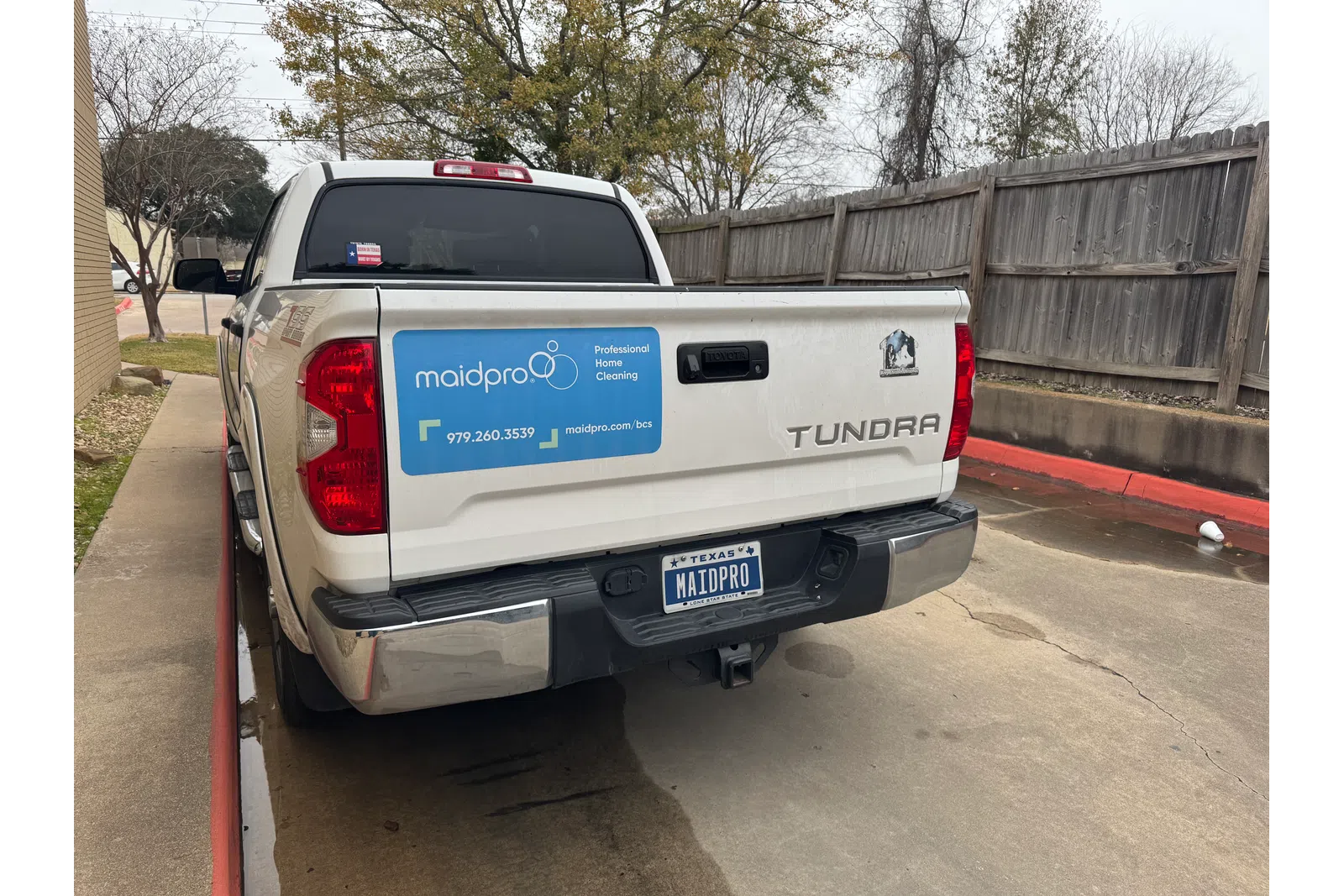 a white truck with a blue sign