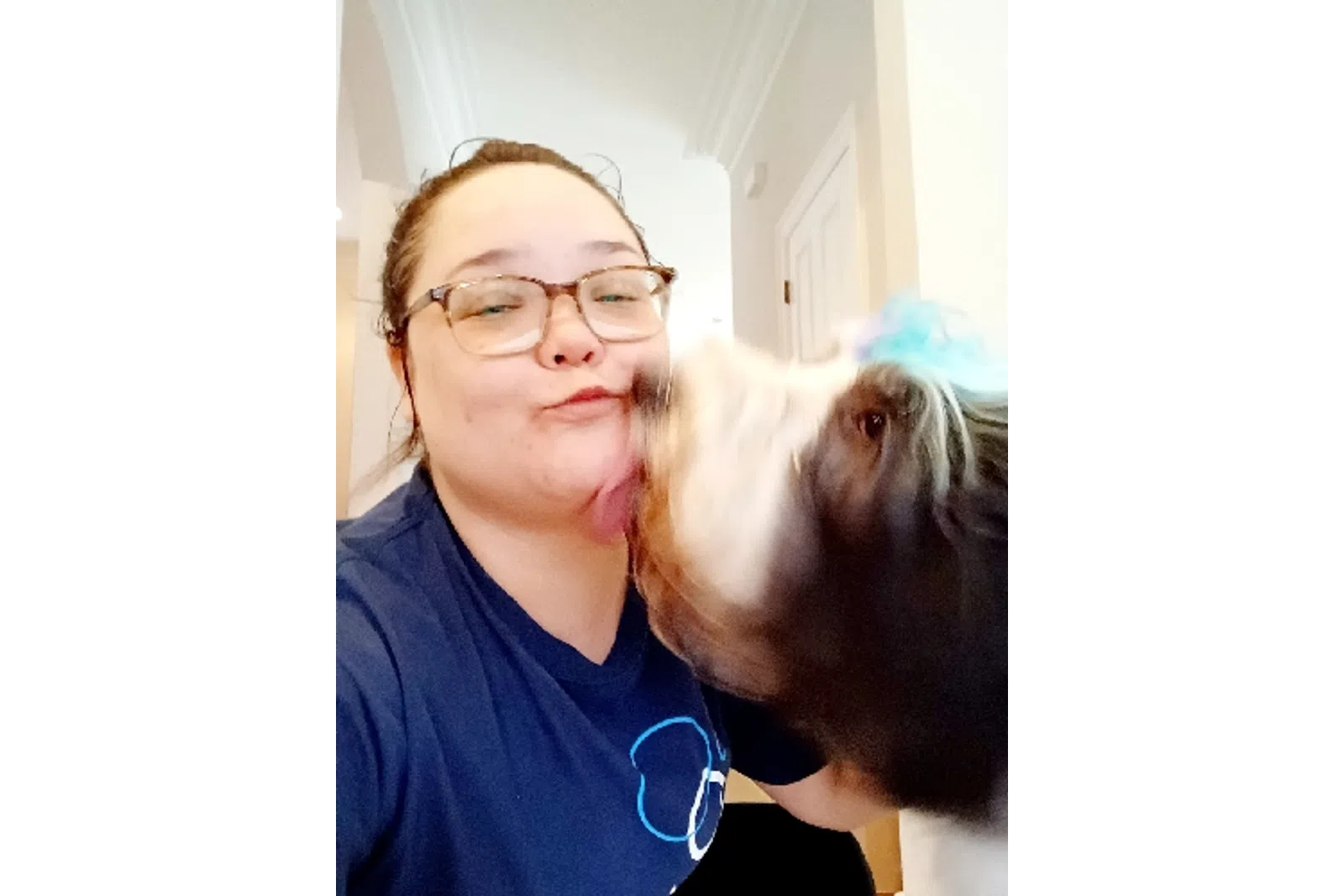MaidPro Salisbury employee taking care of a customer's dog