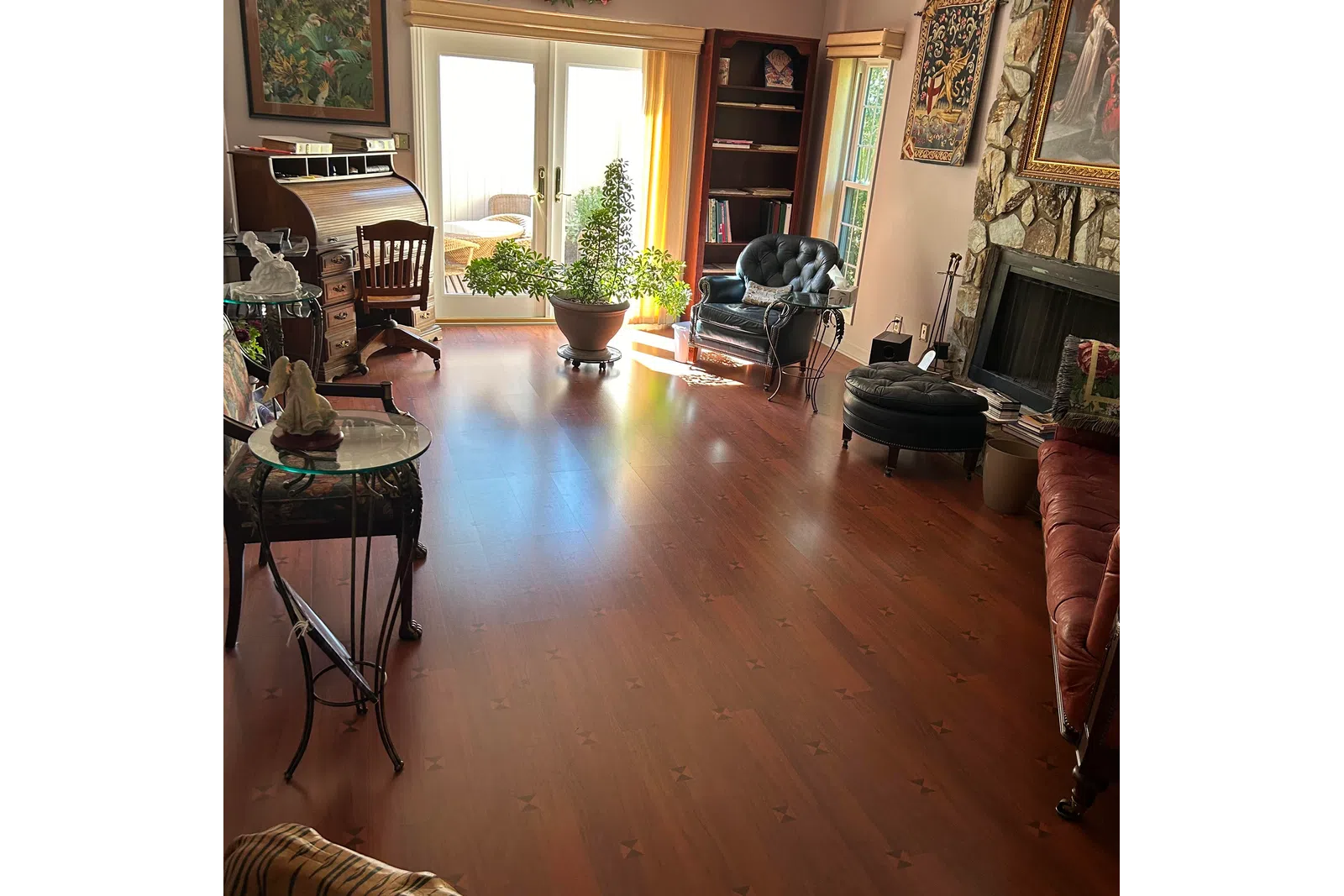 a room with a fireplace and a table with chairs