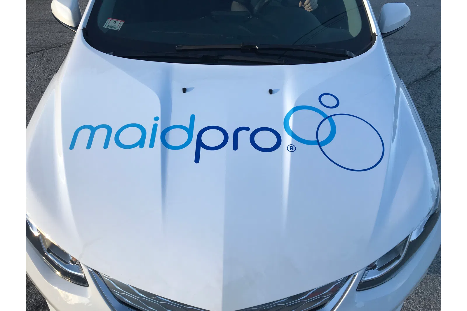 hood of a MaidPro Tyngsborough wrapped company car