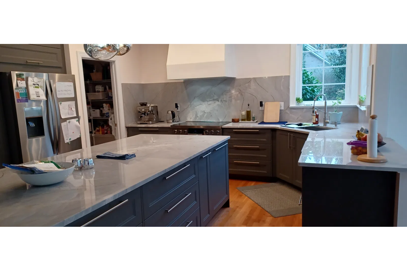 a kitchen with a marble counter top cleaned by cleaning professionals at MaidPro Salisbury