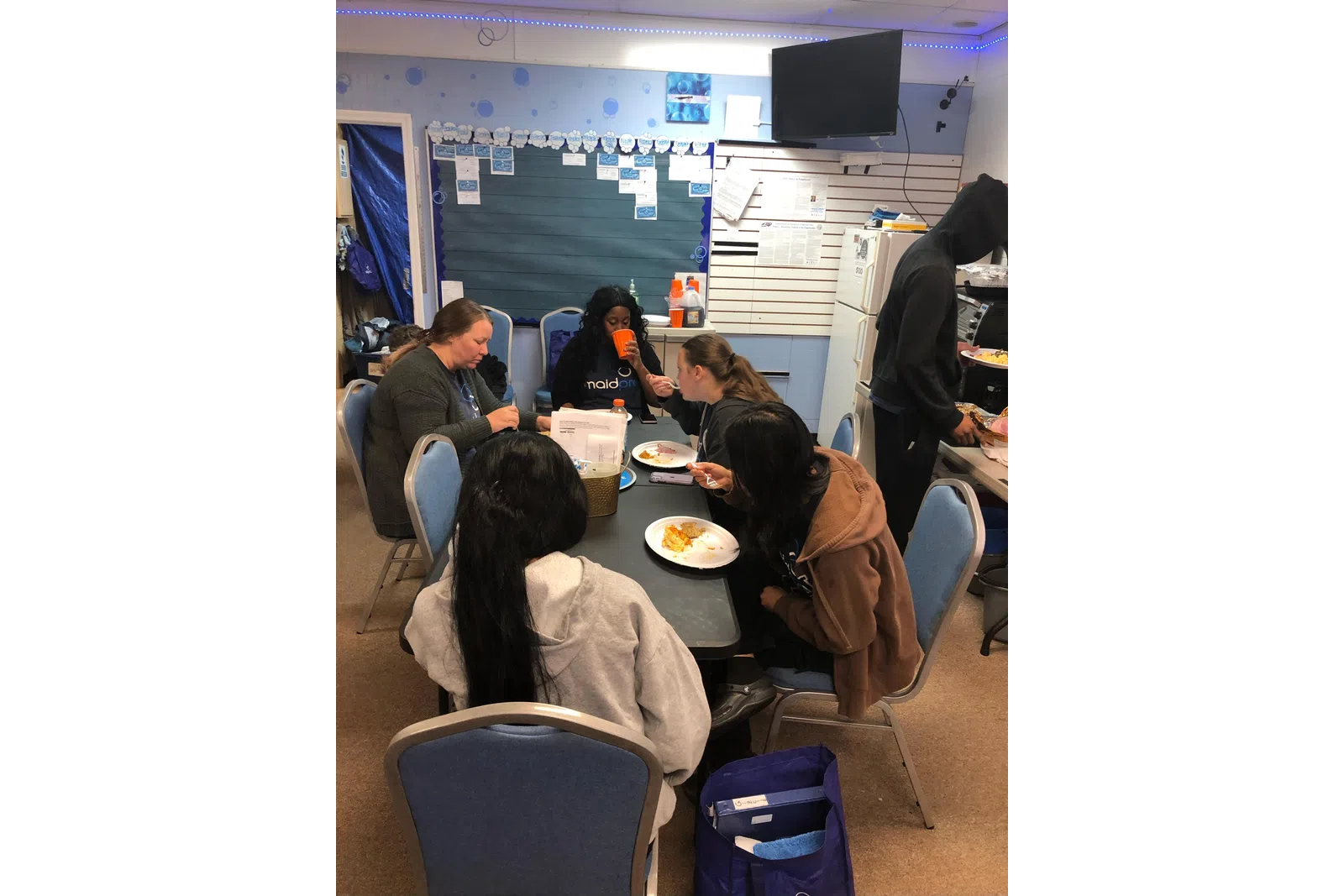 a group of people eating at a table