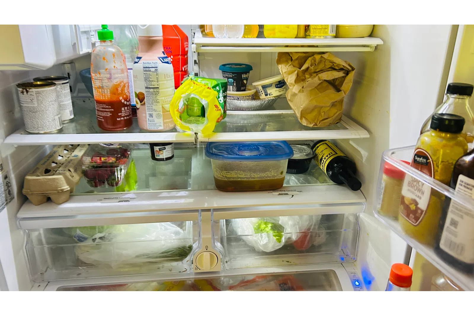 a refrigerator is filled with food