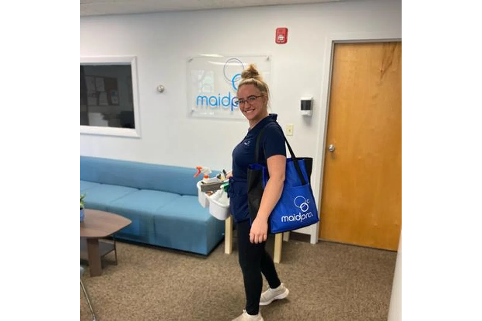 a person holding a blue bag