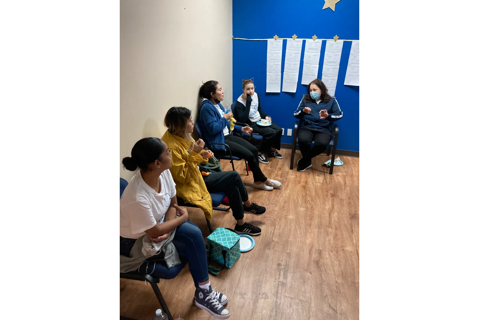 a group of people sitting on the ground