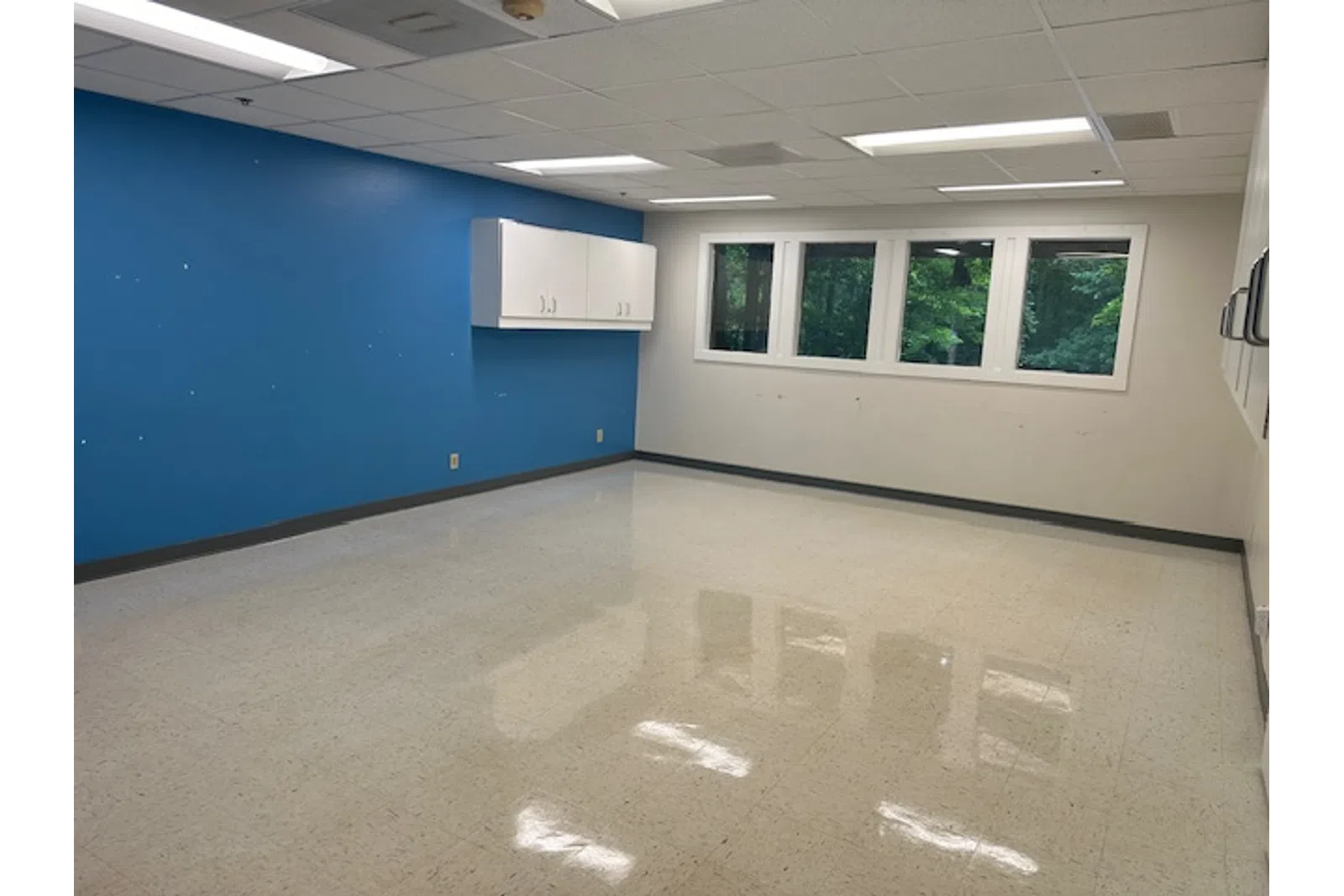 a room with blue walls and white walls