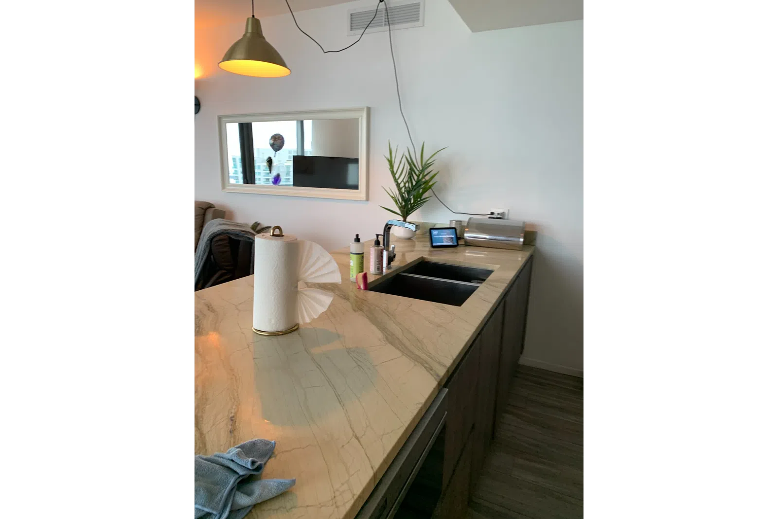 a room with a tv and a lamp