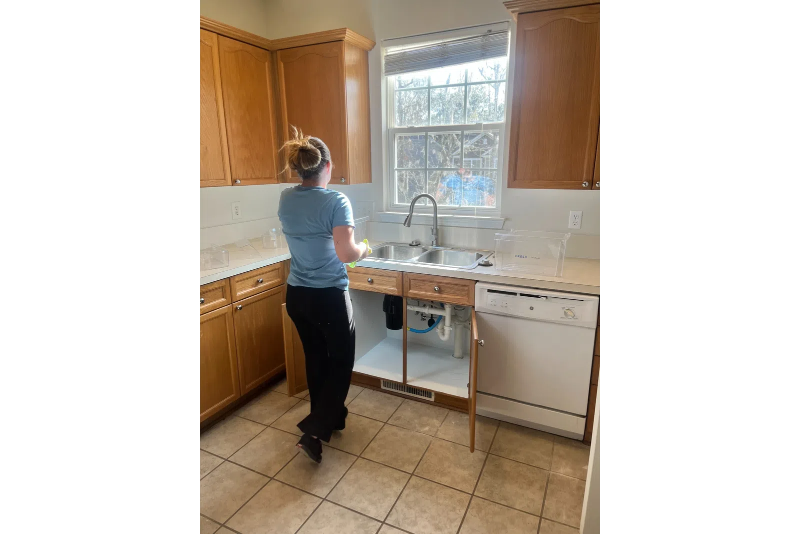 MaidPro Charleston cleaning a kitchen and sink for move-in and move-out cleanings 