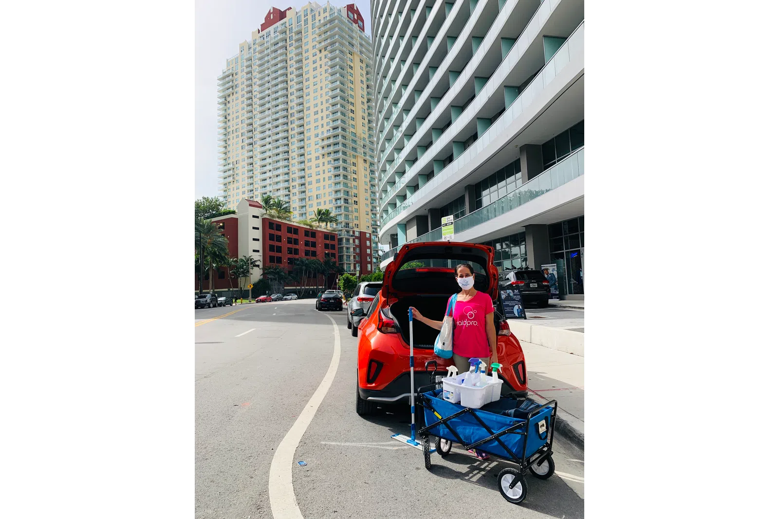 a man pushing a cart with a bag on it