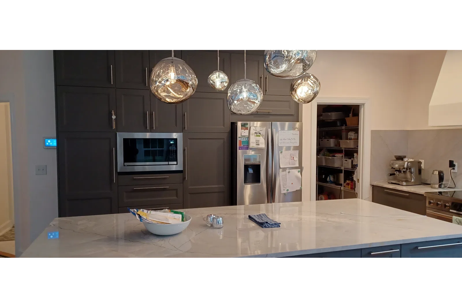 a kitchen with a refrigerator and a microwave cleaned spotless by MaidPro Salisbury