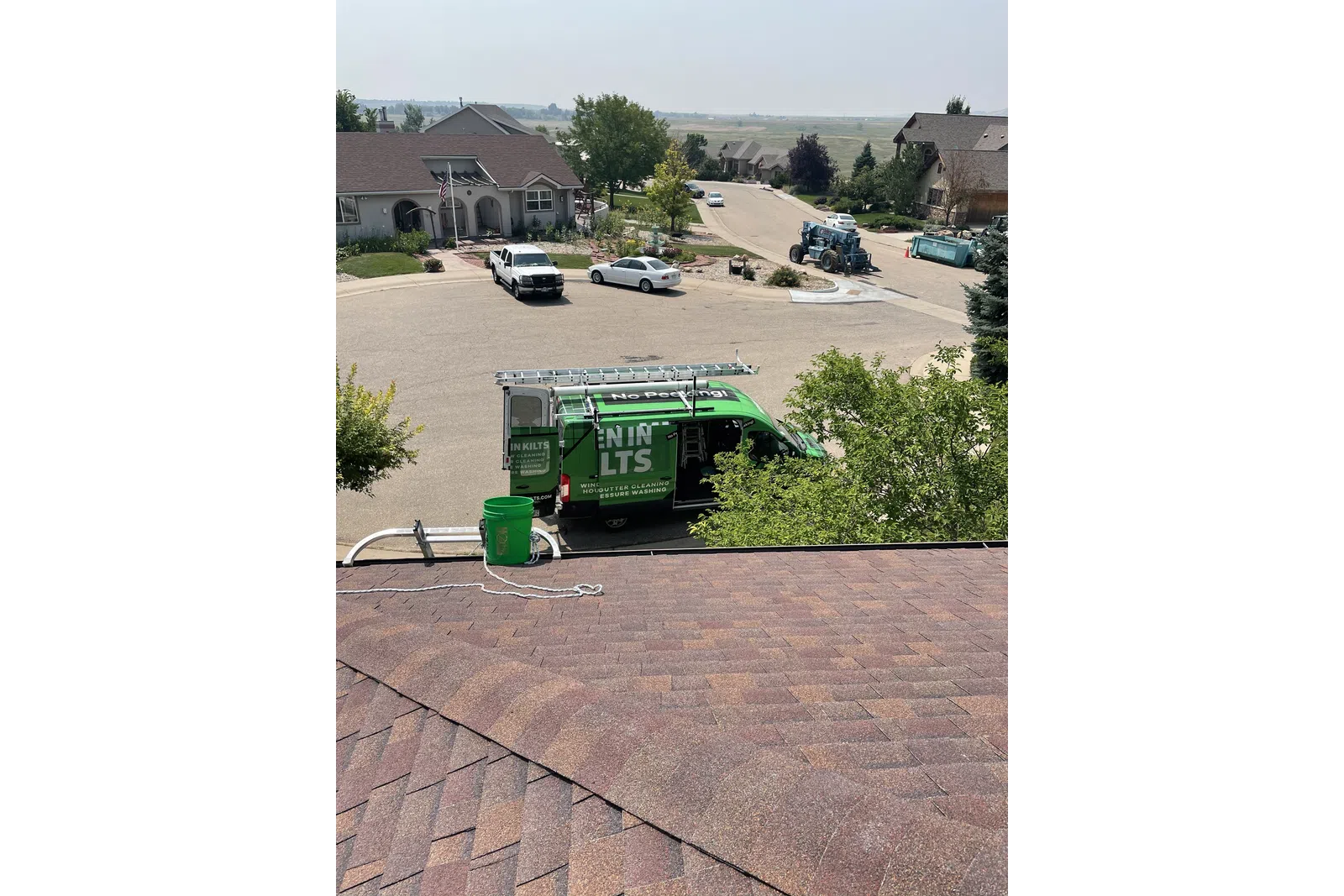 a green machine on a roof