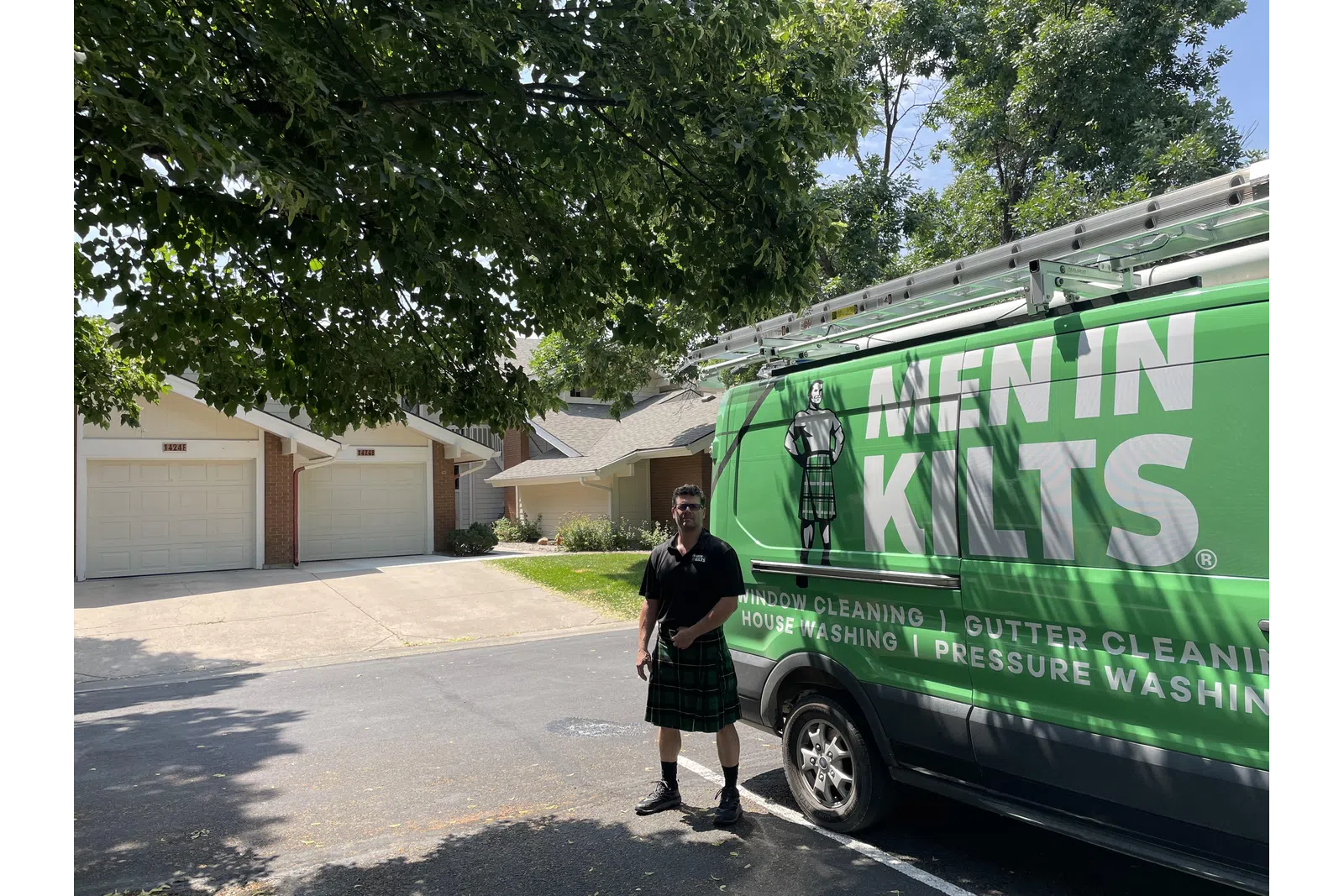 a person standing next to a green truck
