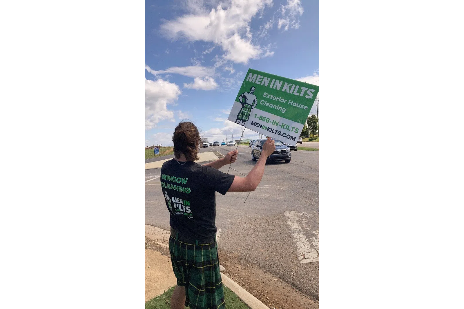 a man holding a sign
