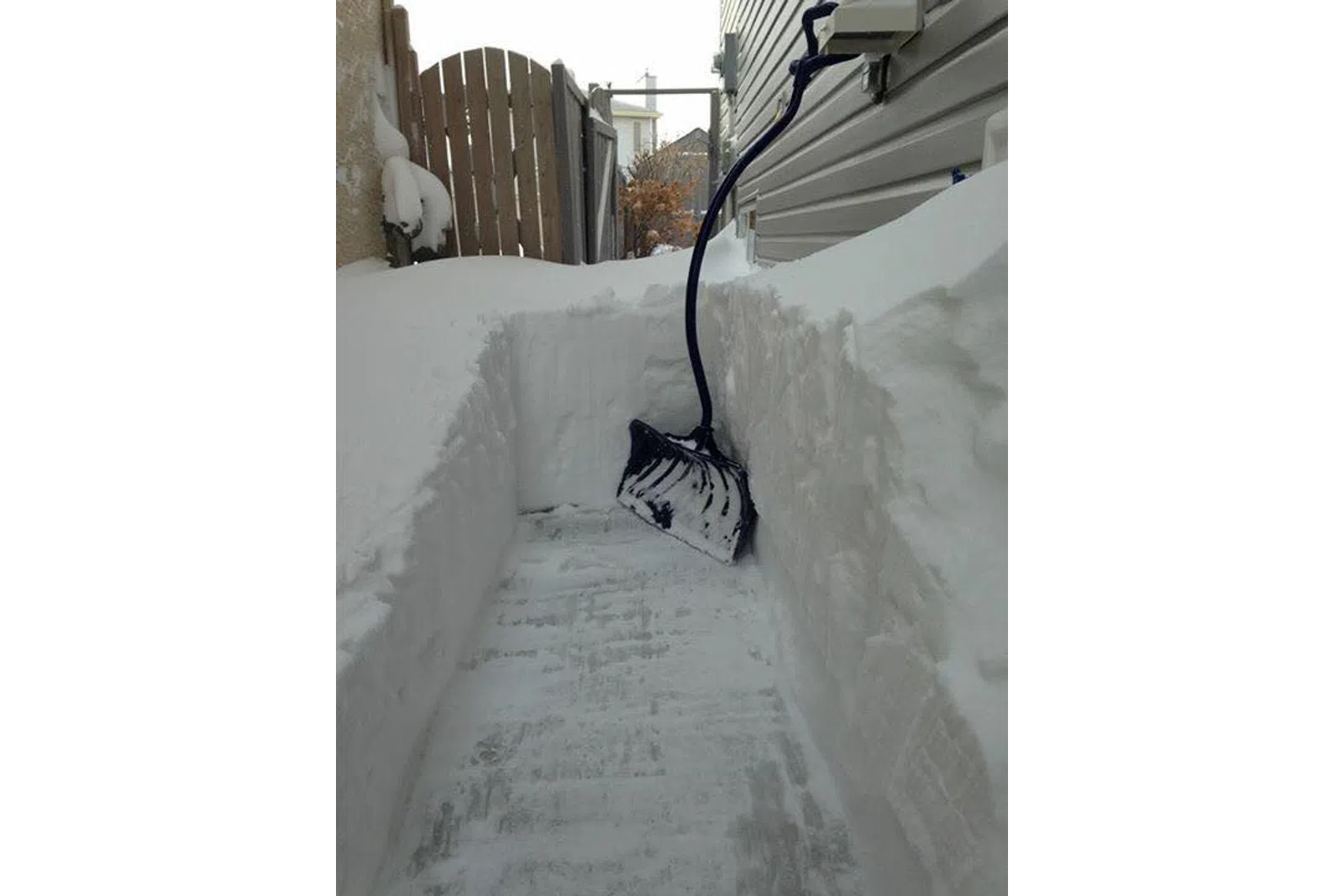a snow covered sidewalk