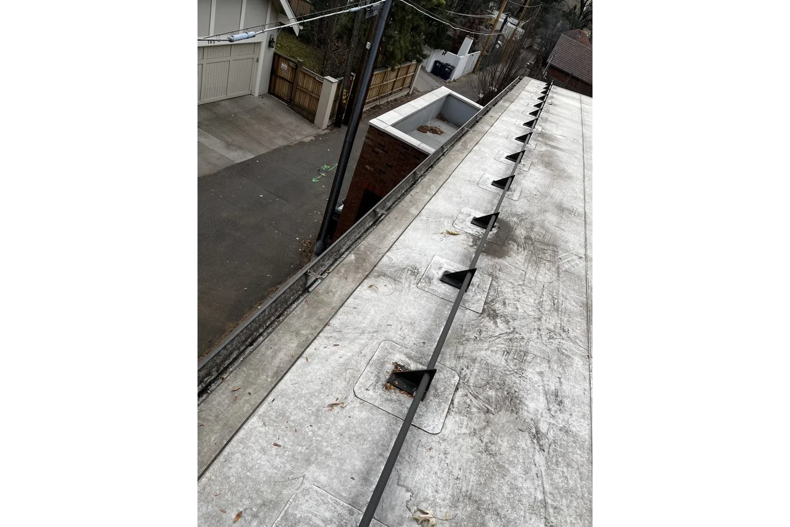 a concrete wall with a pipe