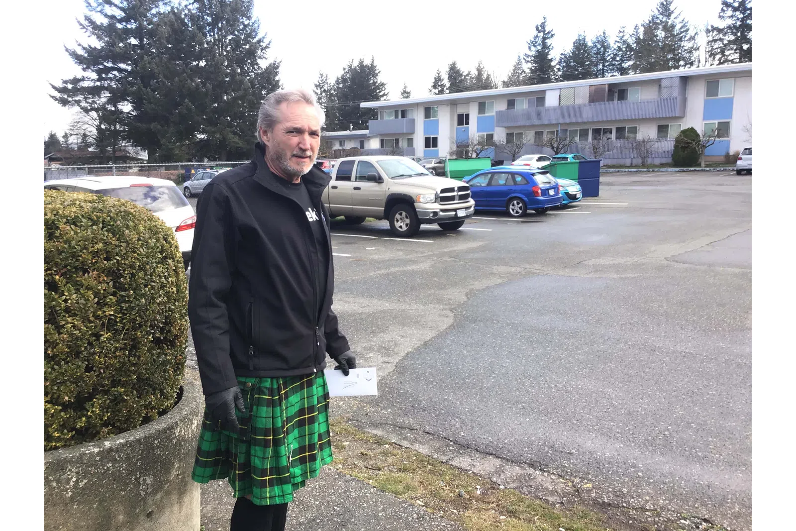 a person standing in a parking lot