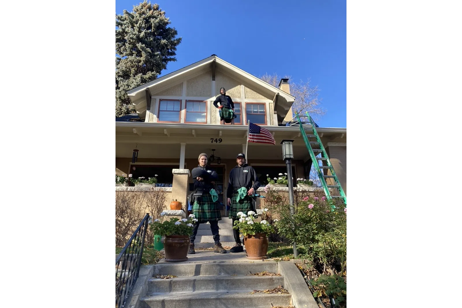 a group of people standing on stairs outside of a house