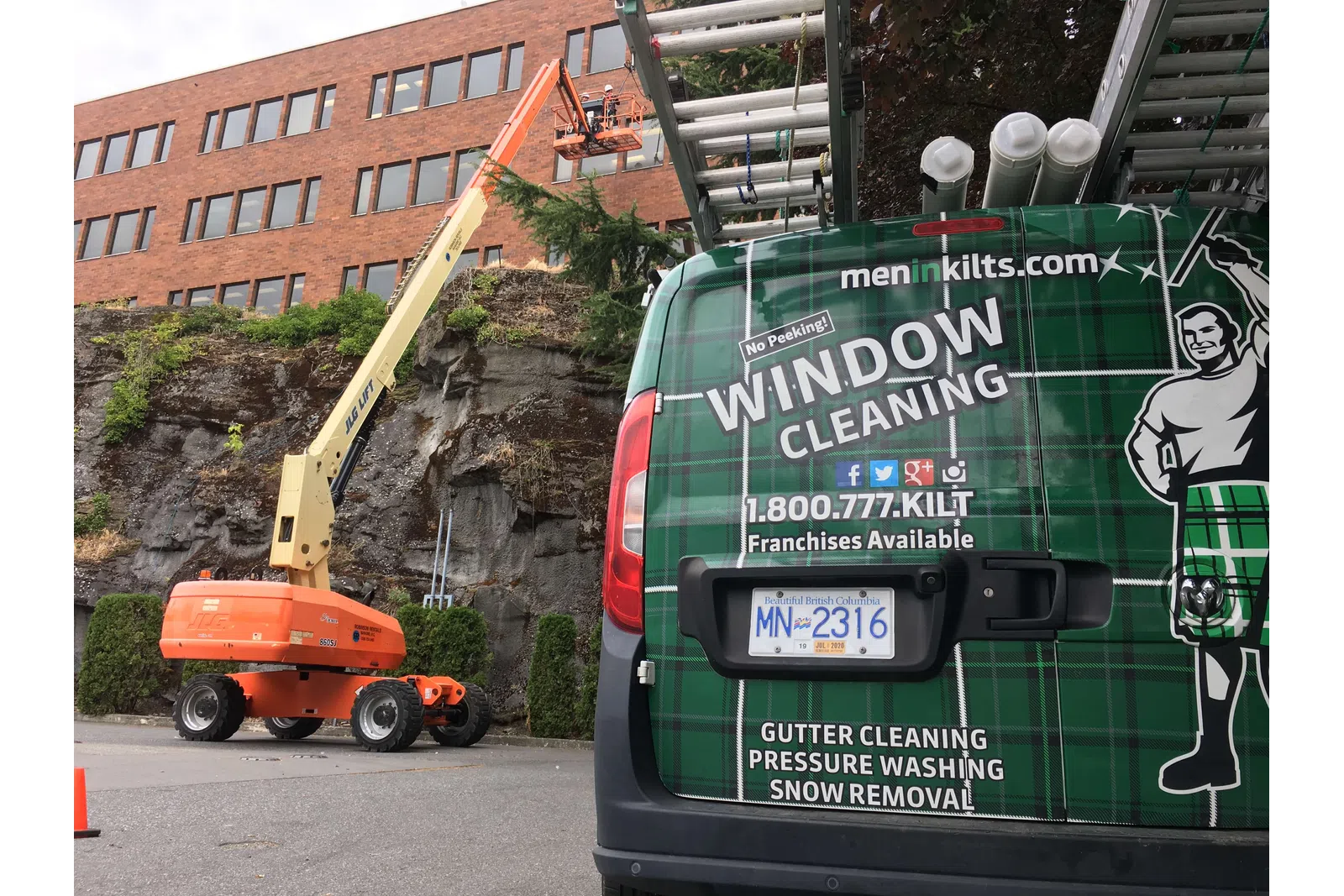 a green truck with a crane