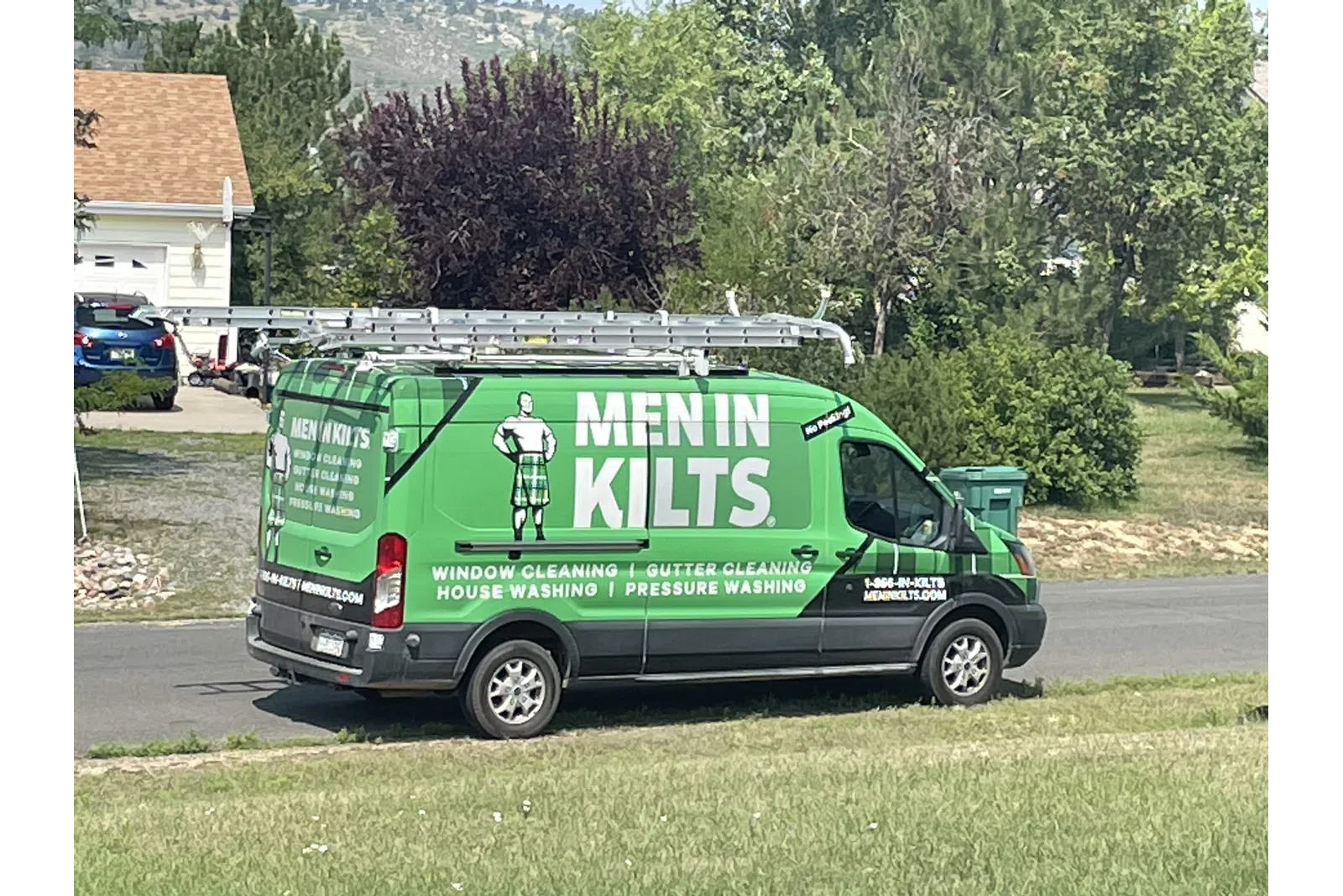 a green van with a sign on it