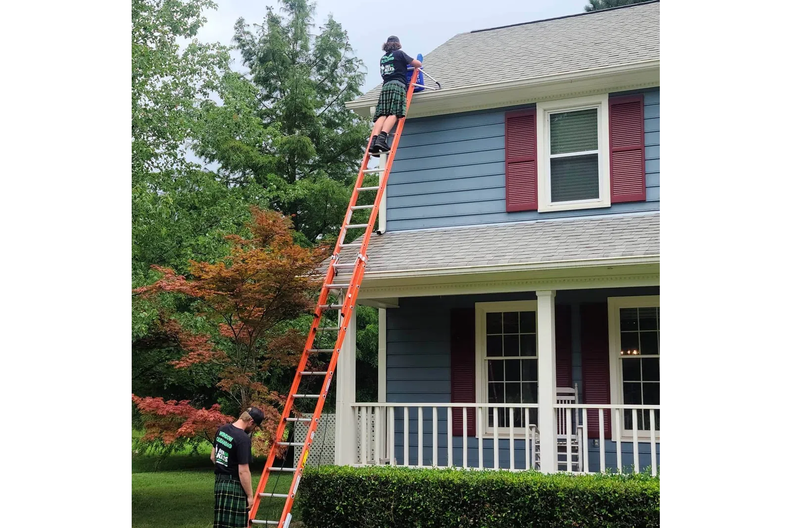 a person on a ladder on a house