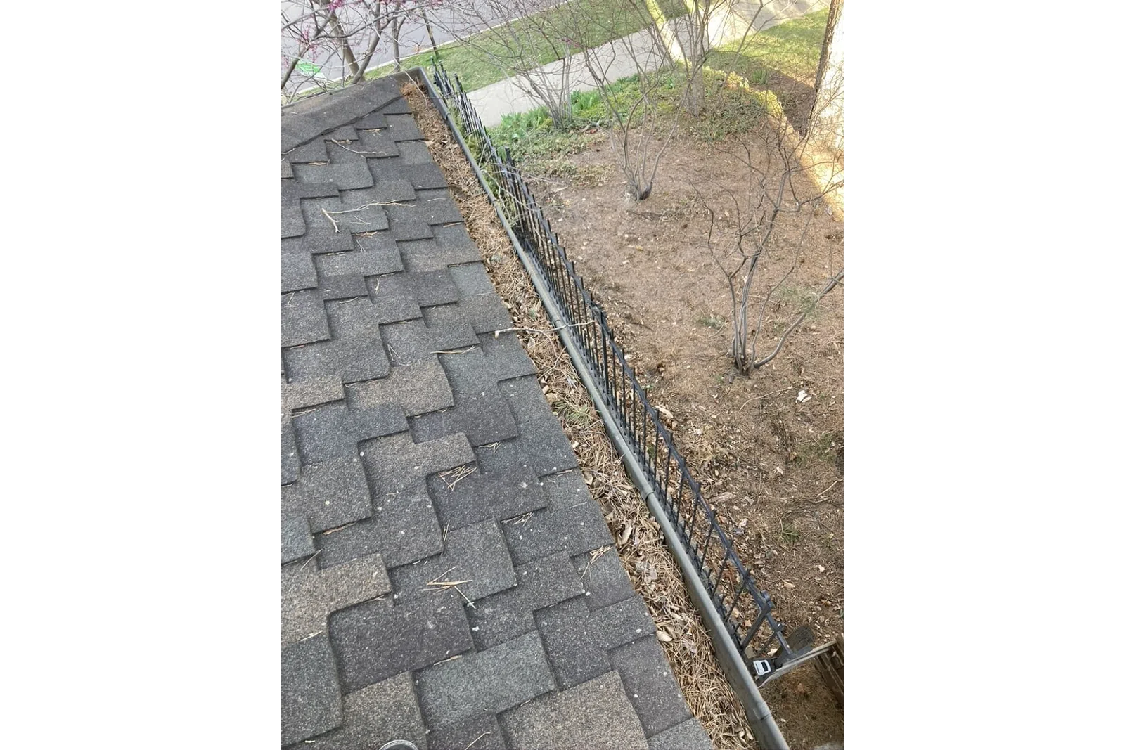 a stone walkway with a fence