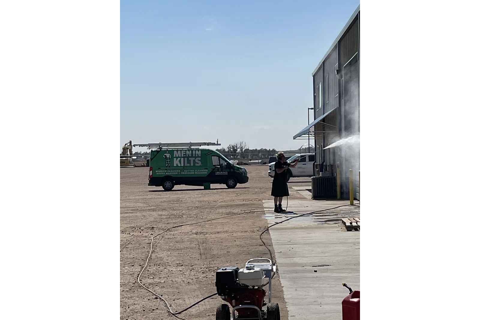 a person standing next to a green truck