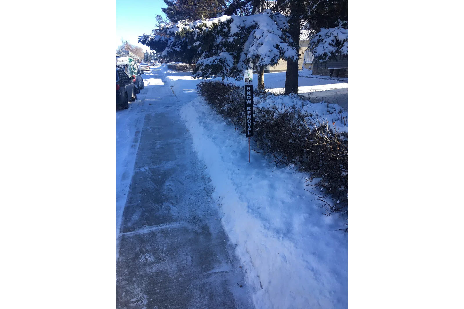 a road with snow on the side