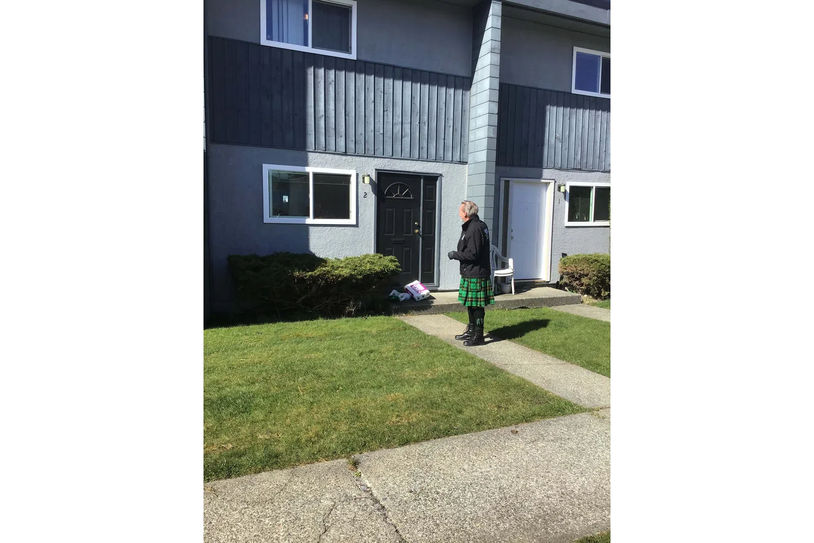 a person standing outside a house