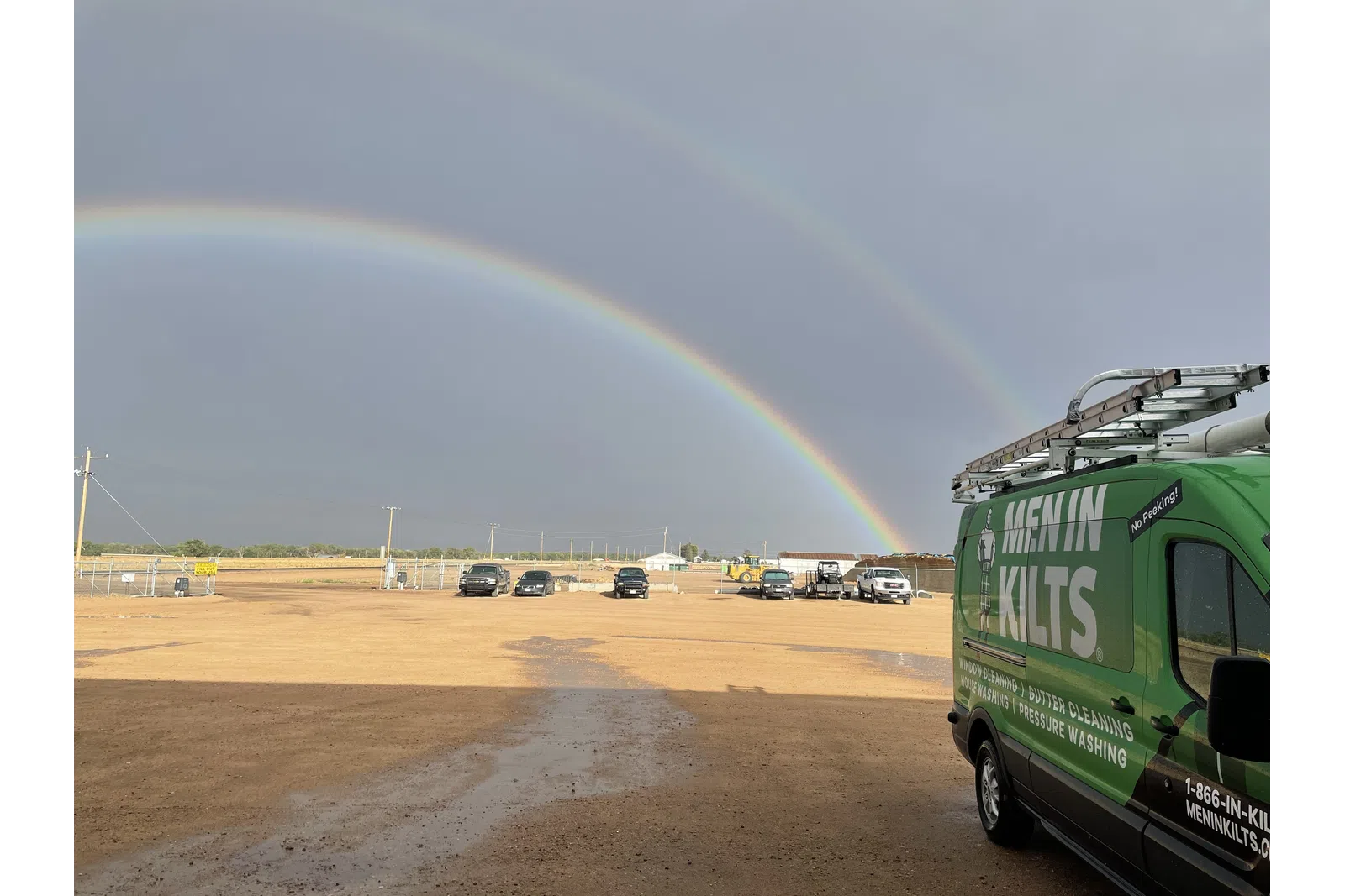 a rainbow over a parking lot