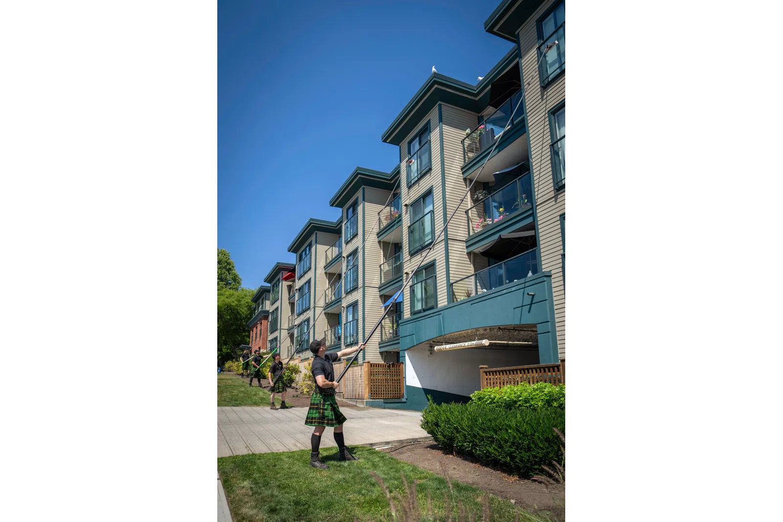 a person standing in front of a row of houses