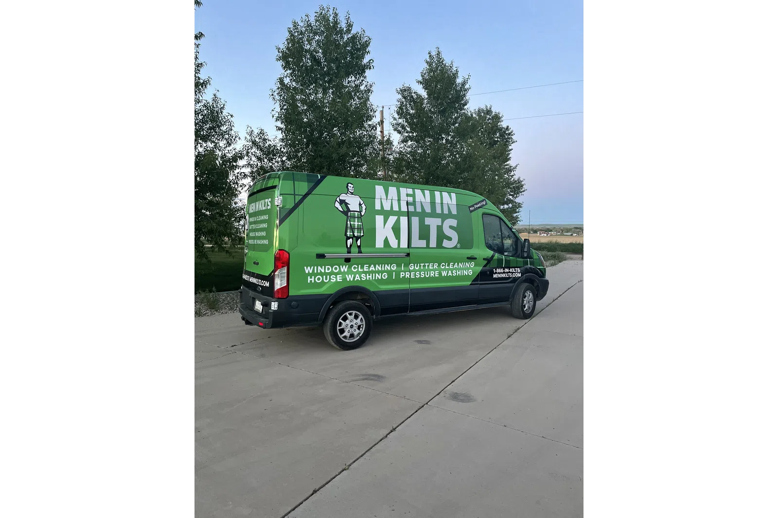 a green van with a white sign on it