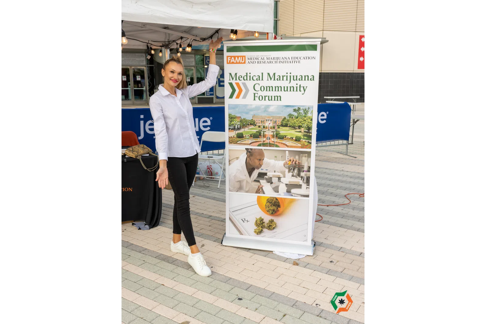 a person standing next to a sign