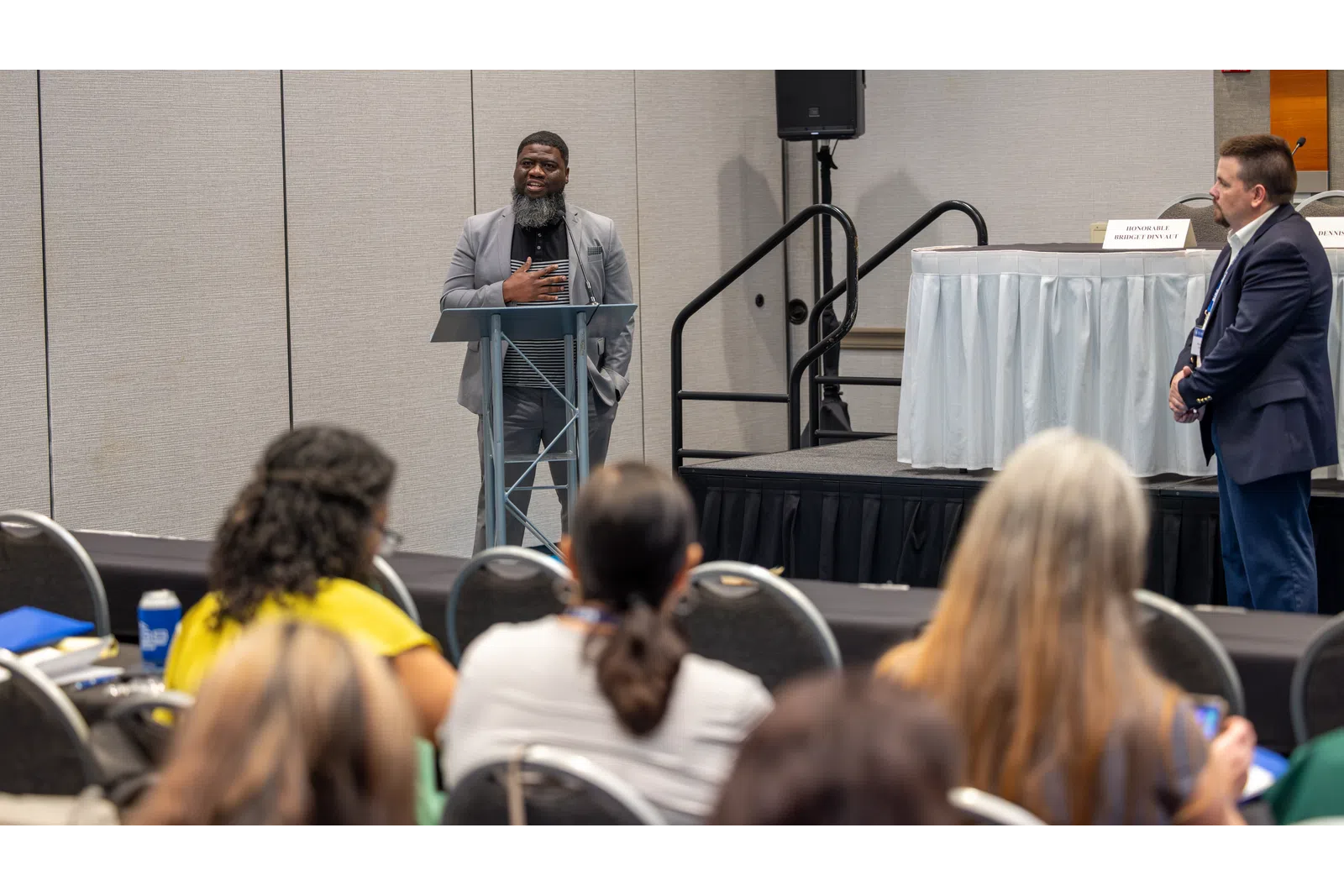 a person speaking to a group of people