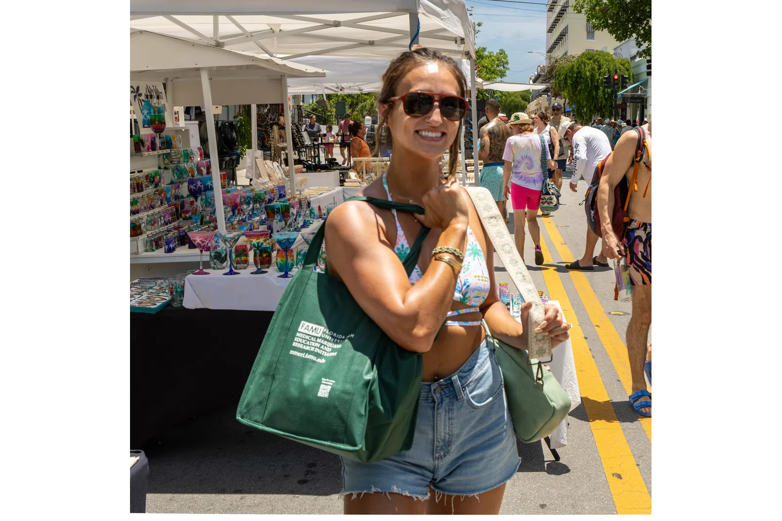 a woman holding a green bag