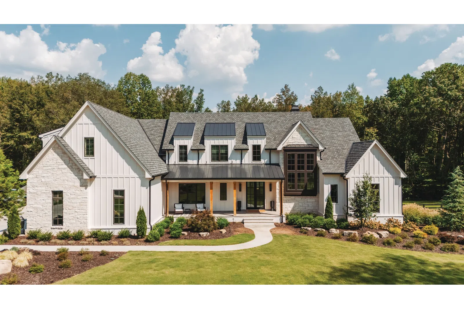 Modern farmhouse window installation in Nashville, TN, showcasing the popular black-on-white exterior trend with high-efficiency glazing.