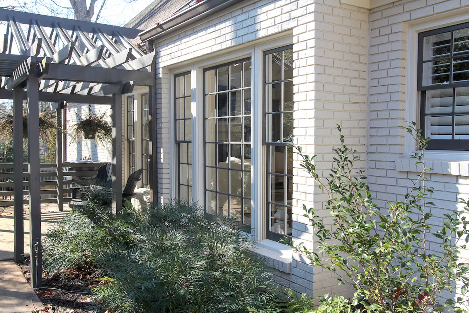 a house with a deck and plants