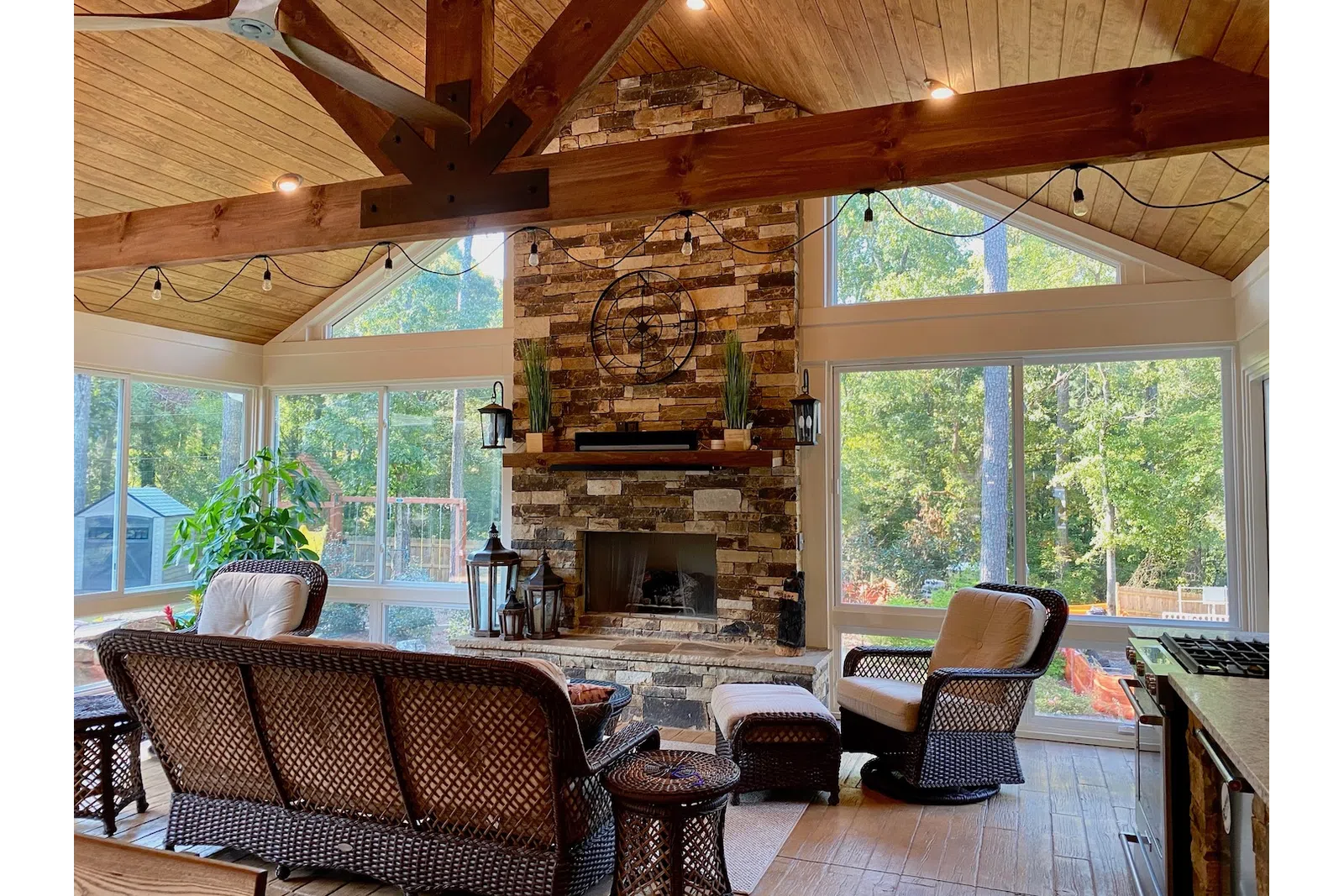 a room with a fireplace and chairs