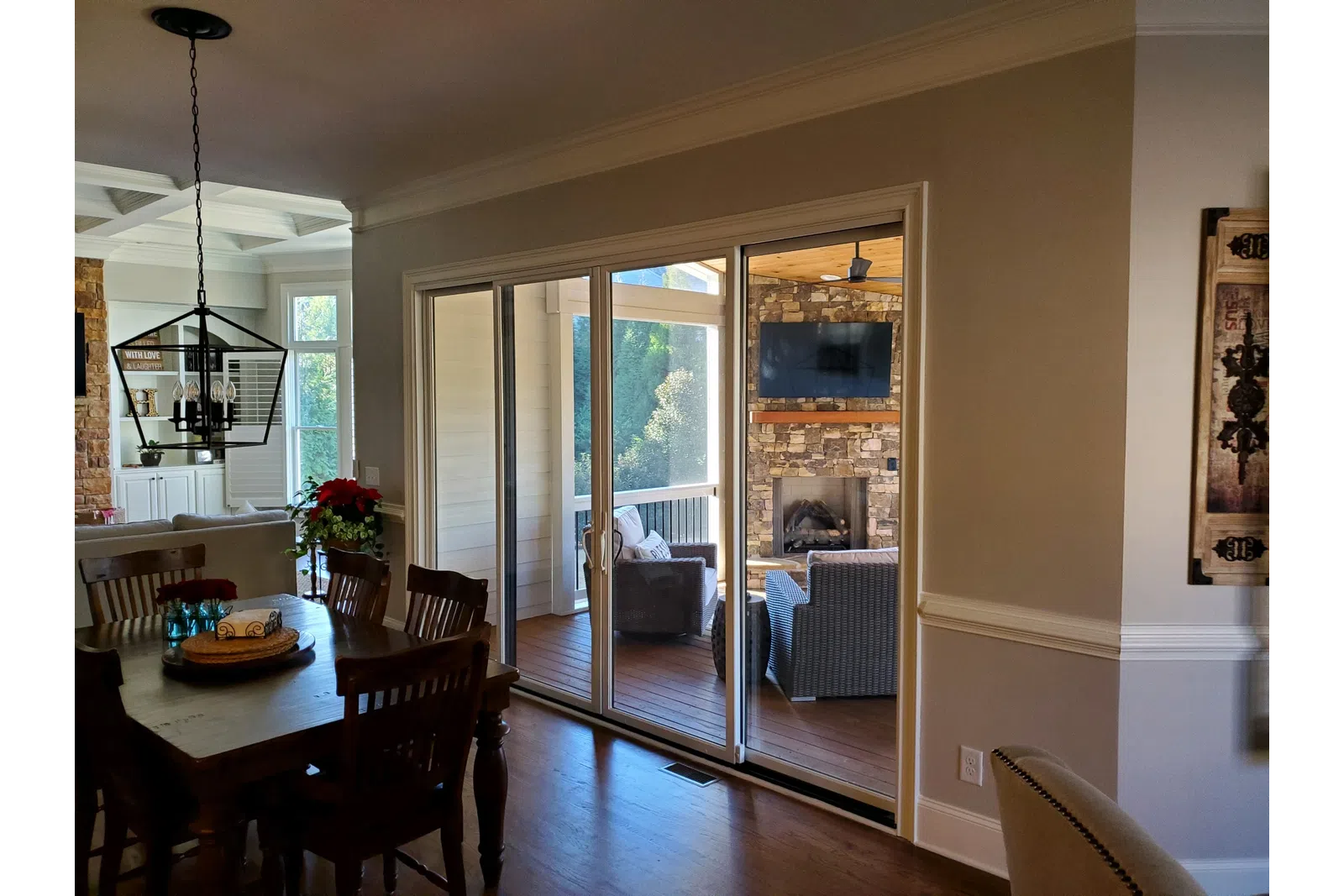 a dining room with a large glass door