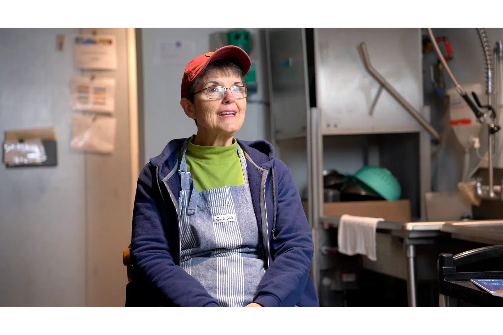 a person wearing a hat and glasses