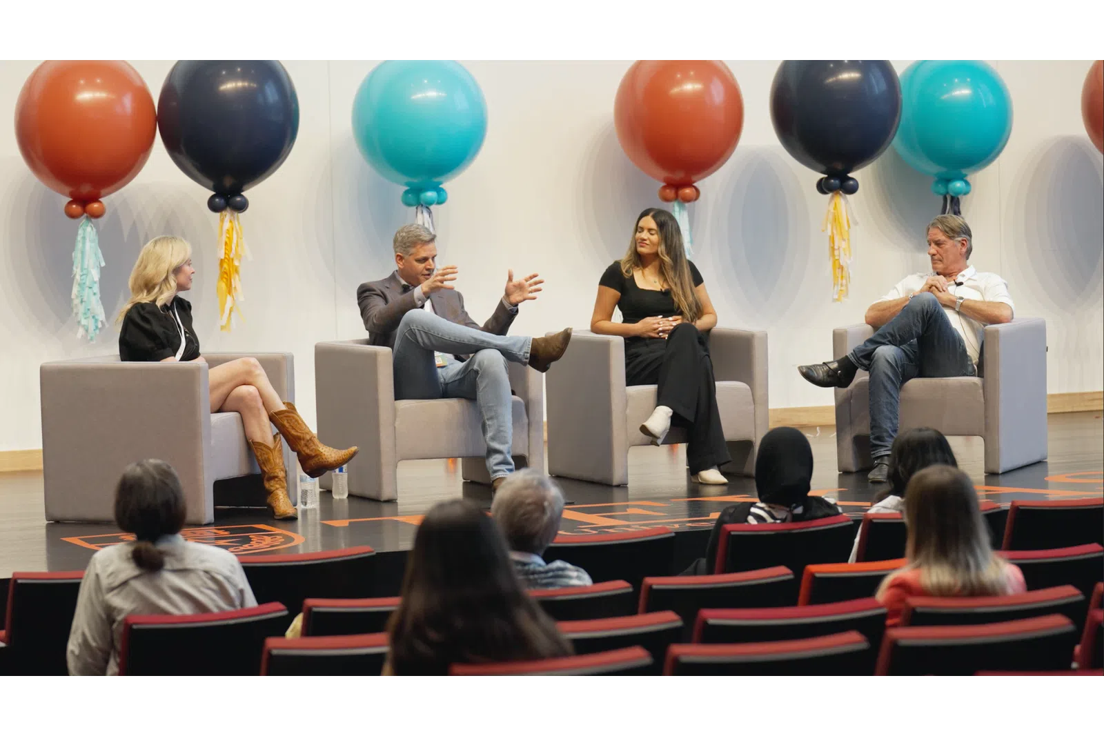 a group of people sitting in chairs