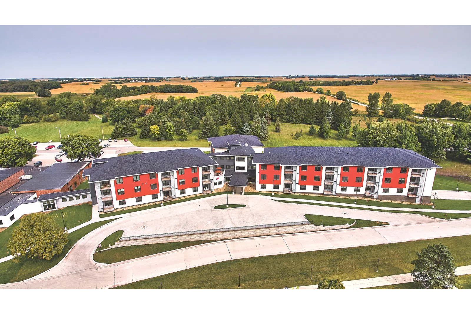 a group of buildings with trees in the back