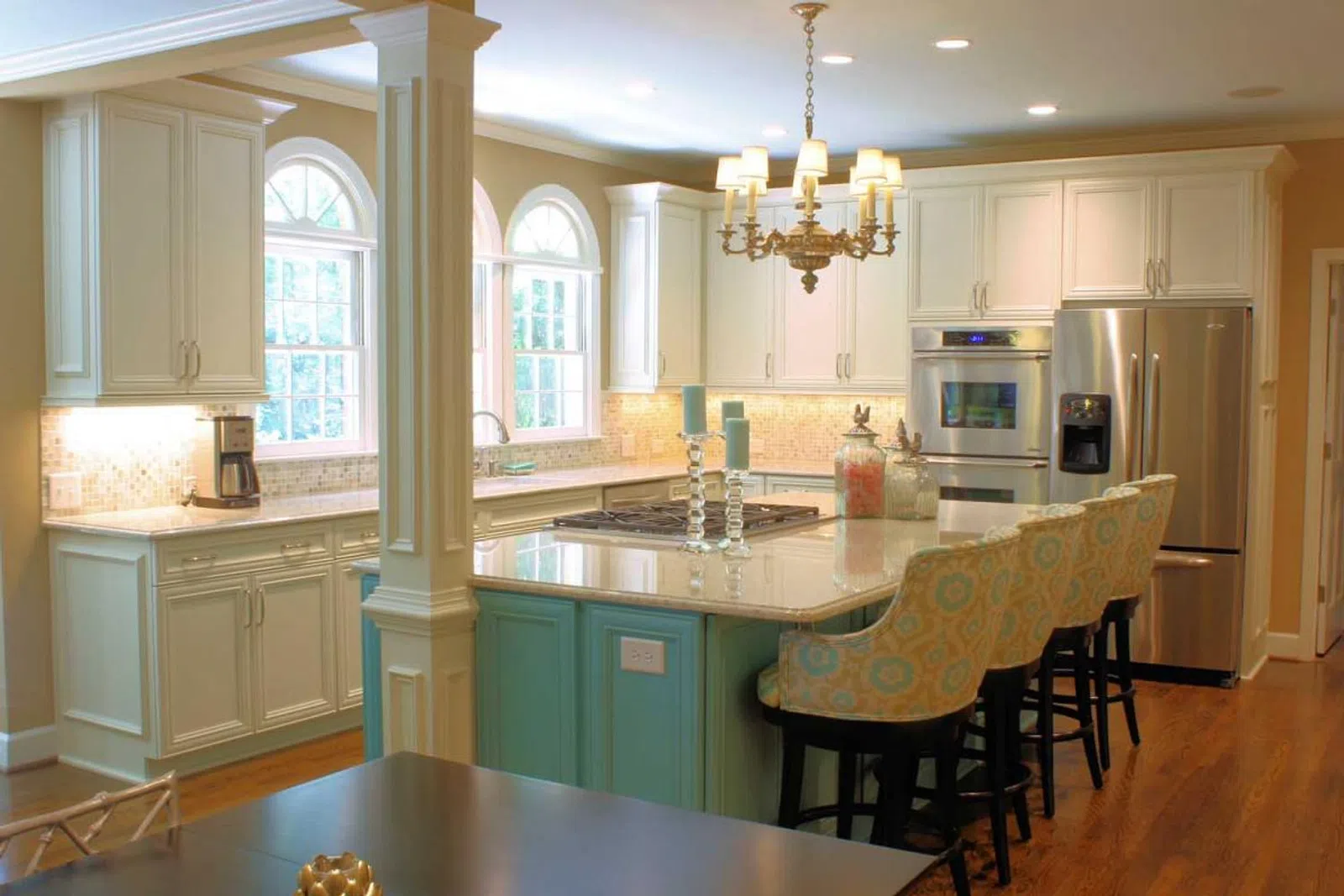 a kitchen with a sink and a dining table