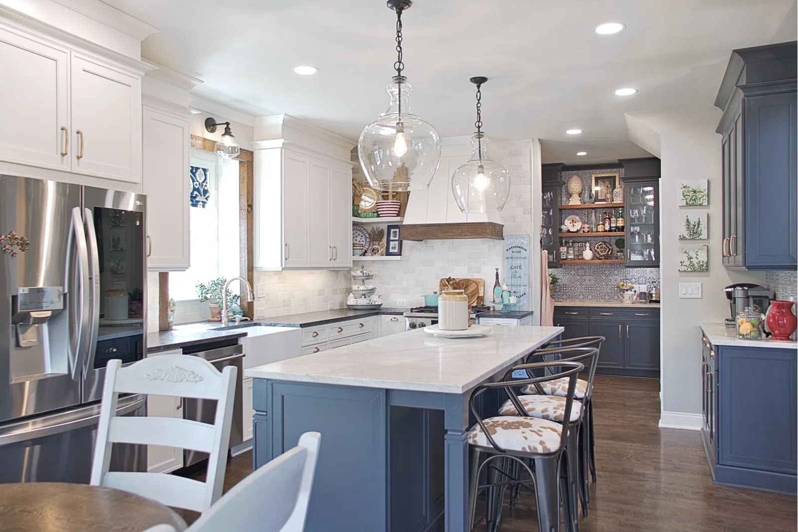 a kitchen with white cabinets