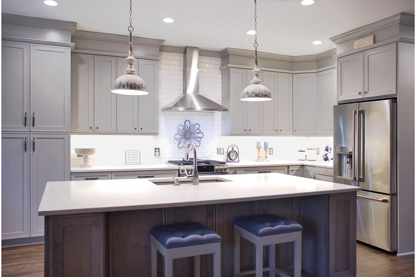 a kitchen with a sink and a mirror